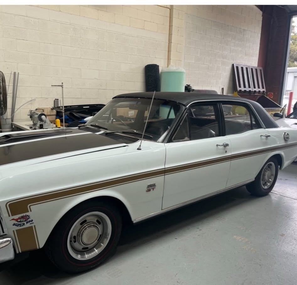 A Ford XW GTHO Phase II inside a workshop, photographed by Hills Cars Direct